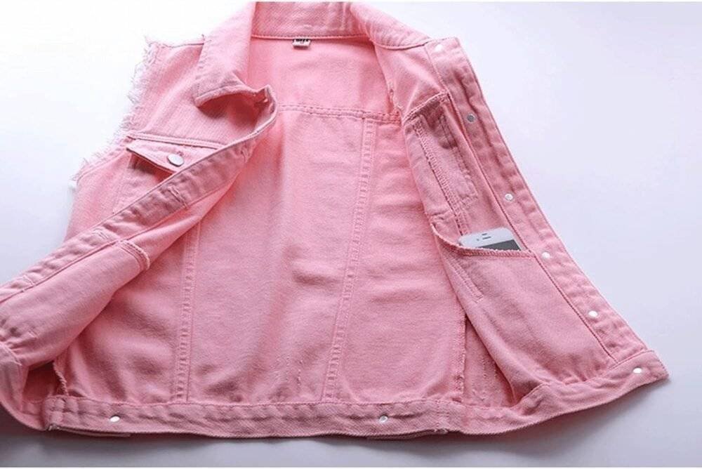 Close-up of pink denim vest fabric