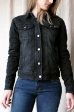 Model in women denim motorcycle jacket front view