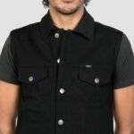 Close-up of black denim vest mens material