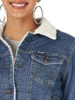 Close-up of womens denim jacket with sherpa lining fabric