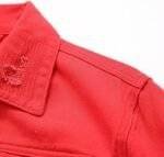 Close-up of red denim jacket mens fabric