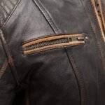 Close-up of the material and stitching on women’s biker clothing.