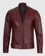 Men's maroon cafe racer leather jacket with snap-button collar and front zipper.