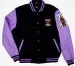 Purple and black varsity jacket with contrasting sleeves and ribbed cuffs.