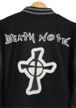 Close-up of the Death Note wool/leather black varsity jacket's back, showcasing the ribbed panel.