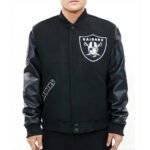 A model wearing the Las Vegas Raiders logo black letterman jacket