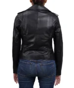 Model wearing women's black biker style leather jacket back view