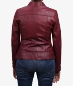 Model wearing women's slim fit maroon leather jacket back view