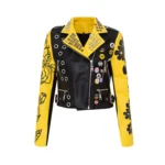 Yellow and black punk-style moto jacket with patches and zipper closure.