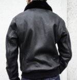 Back view of the men's aviator leather jacket, showcasing the zipper closure, pockets, and detachable fur collar.