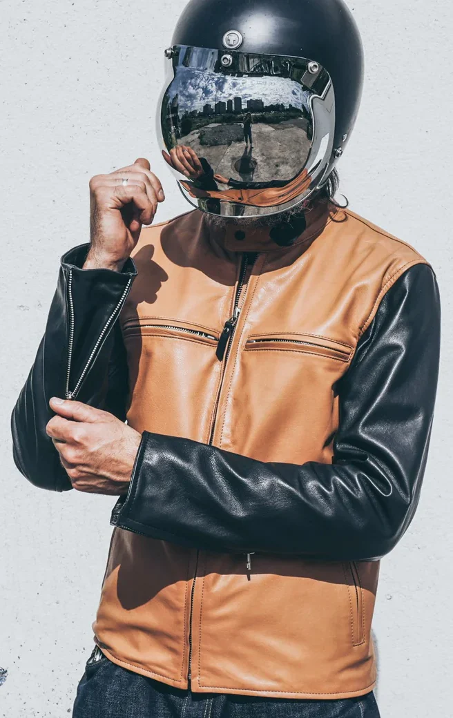 Men's tan and black cafe racer leather jacket with a streamlined silhouette and removable armor.