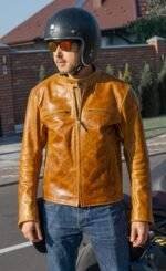 Orange and brown leather racing jacket with armor protection and a classic biker silhouette.