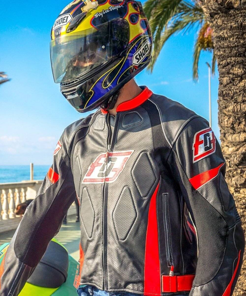 Front view of a sport biker rider jacket with a curved sleeve design, multiple pockets, and a stylish look.