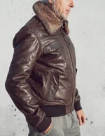 Right side view of the men's brown vintage aviator leather jacket, showcasing the snap closure and side pockets.