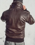 Back view of the men's brown vintage aviator leather jacket with side entry pockets and a tailored fit.