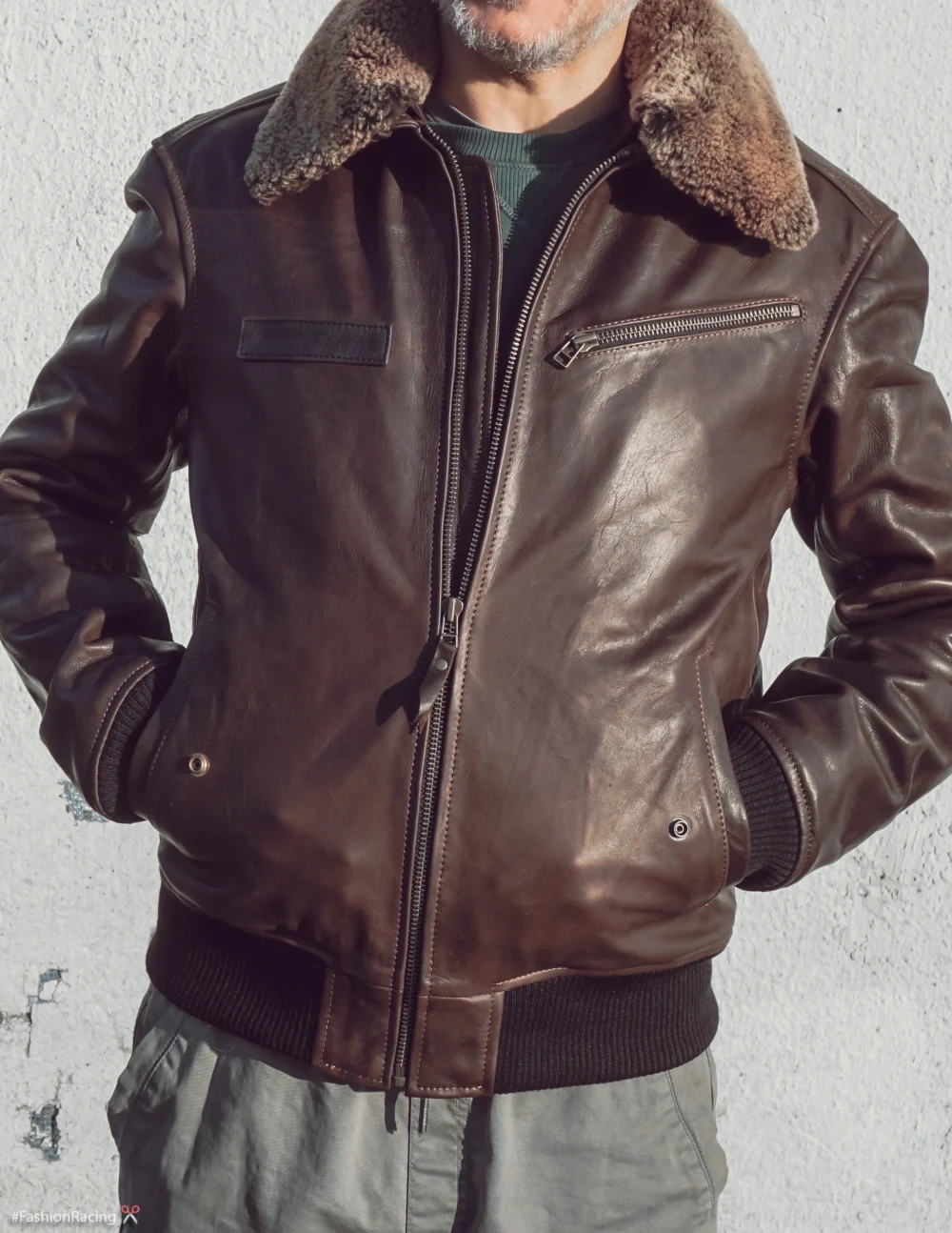 Men's brown vintage aviator leather jacket with detachable natural fur collar and snap closure, open.